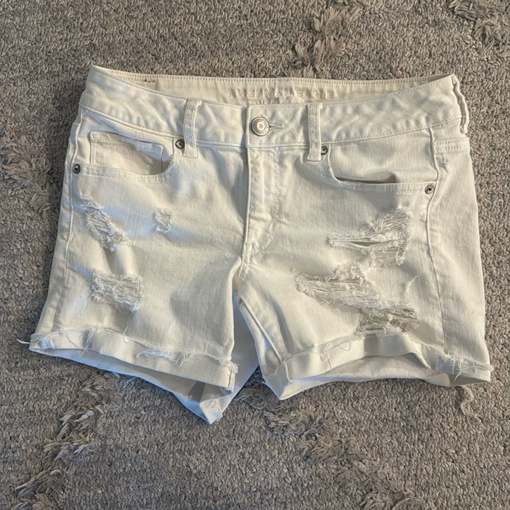 American Eagle size 8 distressed midi Jean shorts in white